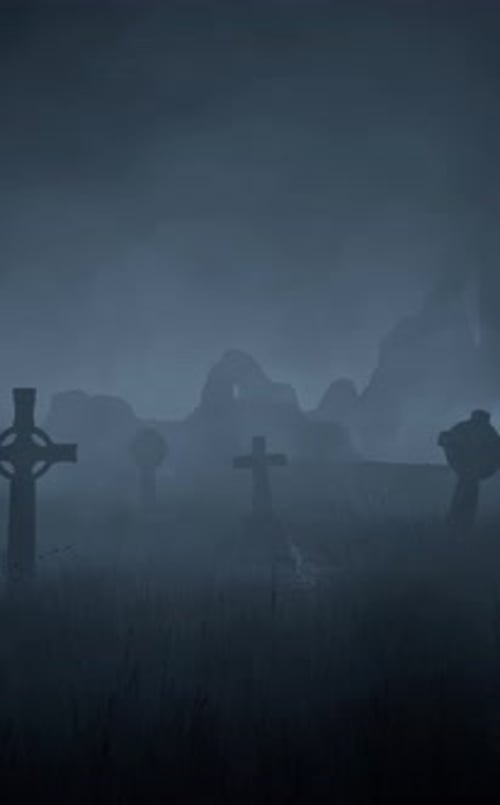 Old abandoned cemetery with tombstones sticking out in all directions, near ancient ruins. Halloween