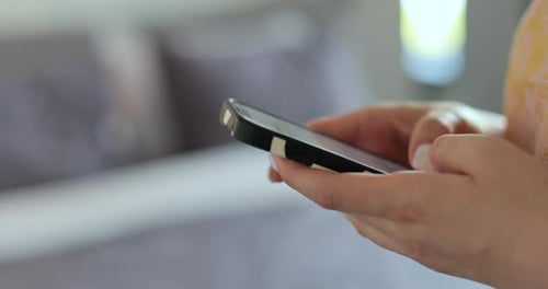 Close Up Woman's Hands Using Mobile Phone