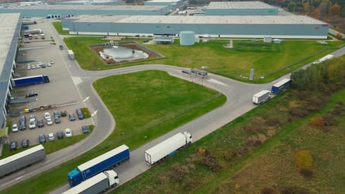 Logistics in Motion Semi Trucks Navigating a Modern Distribution Hub