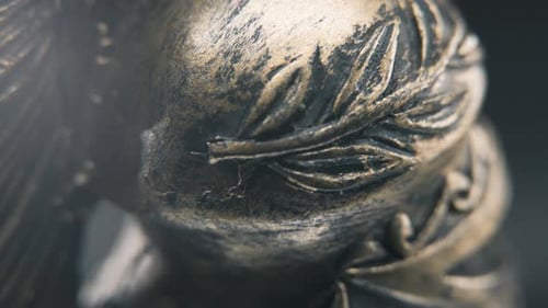 A dynamic close up slow tilt down shot of a spartan face design, warrior ancient greek bronze helmet