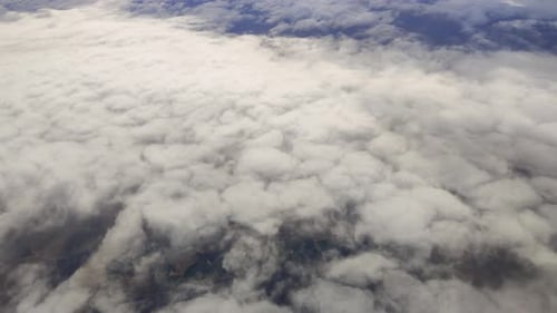 Flying above the clouds, a serene and relaxing moment. Blue sky. Backgrounds and textures.