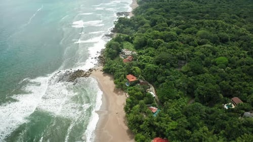 4K Aerial Drone shot of Tambor Empty Beach in Costa Rica.
Dramatic Weather with Waves Smashing again