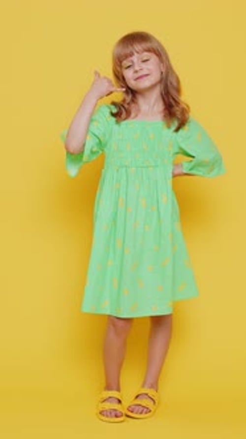 Child Girl Kid Doing Phone Gesture Like Says Hey you Call Me Back Advertising Proposition Vertical