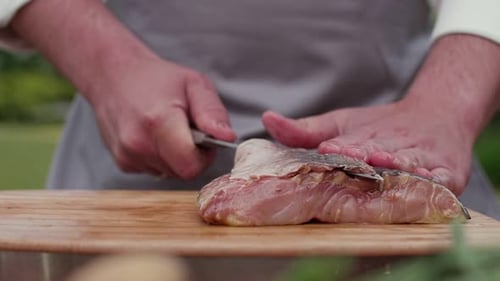 Preparing Fresh Fish on Cutting Board