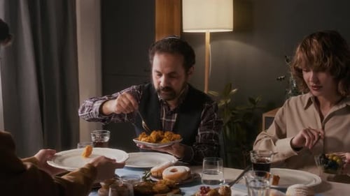 Family Enjoys Traditional Meal Together at Home