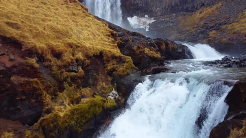 Huge Scenic Waterfall in Iceland Pure Glacier River in Mountains Autumn Colours Aerial View