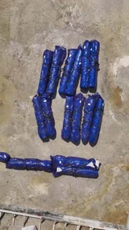 Blue Wrapped Packages on Concrete Surface, Aerial View