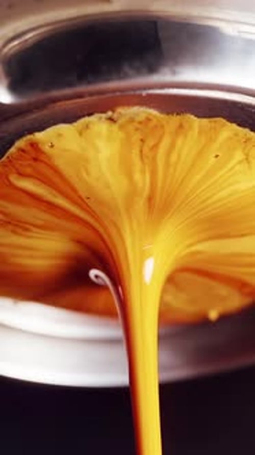 Vertical video. Leaking bottomless portafilter during espresso extraction caused by excessive