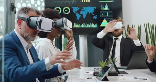 Business Team Wearing Virtual Reality Headsets in Office