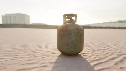 Old Rusted Metal Gas Tank on the Beach