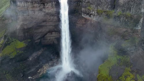 Majestic Waterfall Cascading Down a Rocky Cliff