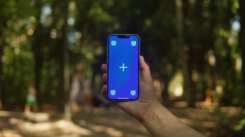 Young Woman Holding Phone Chroma Key Screen in the Lovely Park Closeup Girl with Green Screen on