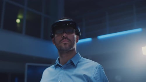 In 3D Content Creating Laboratory Engineer Wearing Professional Virtual Reality Headset Works and G