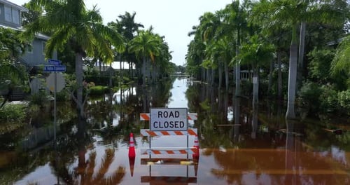 Road Under Water Warning Sign City Street Closed Because of Flooding Danger Blocking Driving of Cars