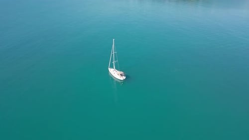 White yacht in the middle of the Mediterranean Sea. The drone flies over a beautiful yacht.