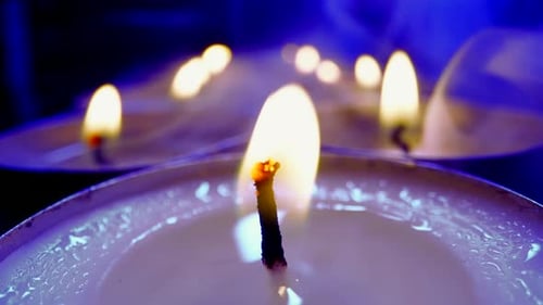 Candle Flames Flicker in the Dark