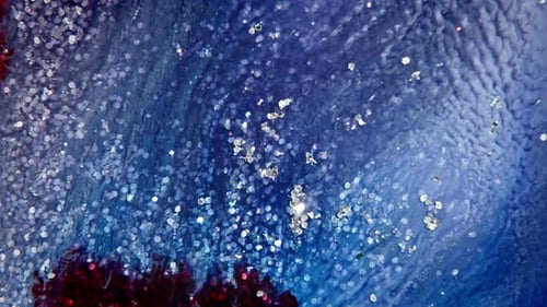 Abstract Blue and Red Liquid with Silver Glitter