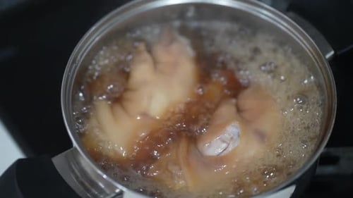 Pork Hock Cooking in Pot of Bubbling Liquid