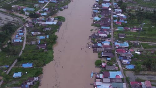 Aerial view of flooded village with floating market, Indonesia.