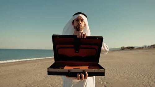 Sheik Opening The Briefcase Towards The Camera