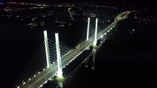 Night Illuminated Industrial Bridge Traffic Transportation Crossing River Sea Aerial City Panorama