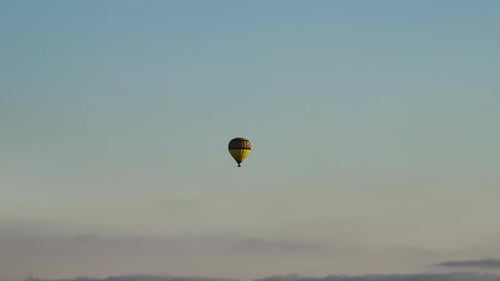 Hot Air Balloon Gliding at Sunset