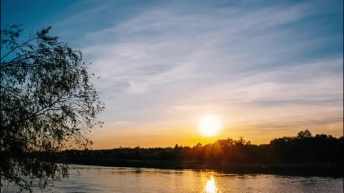 Sunset Over a River in the Countryside