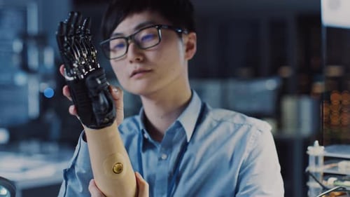 Close Up of a Futuristic Prosthetic Robot Arm Being Tested by a Professional Japanese Development E