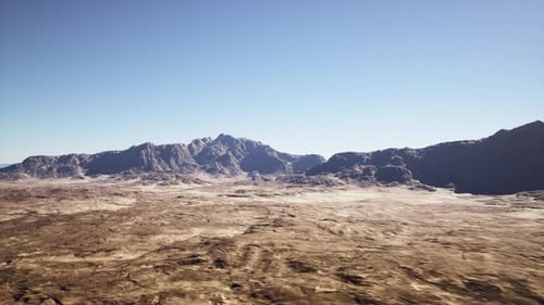 Aerial Flyover Over Arid Desert Mountain Landscape