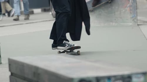 Longhaired Businessman Skateboarding in an Urban Skatepark