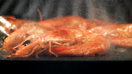 The Shrimp is Fried in a Pan with a Splash Filmed on a Highspeed Camera at 1000 Fps