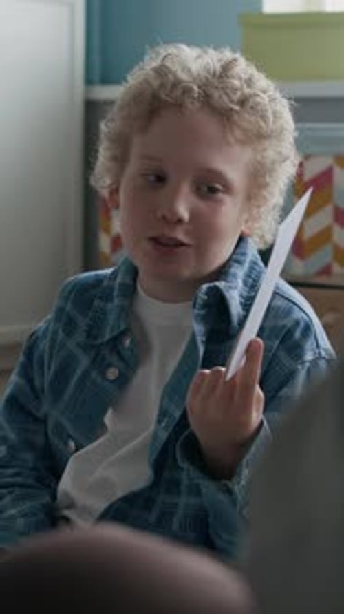 Vertical of Boy with No Bicycles Sign Speaking on Road Safety in Class