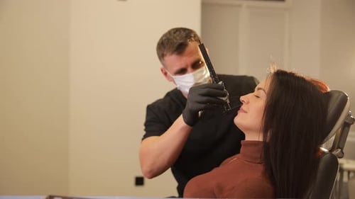 Medical Professional Examining Woman's Face