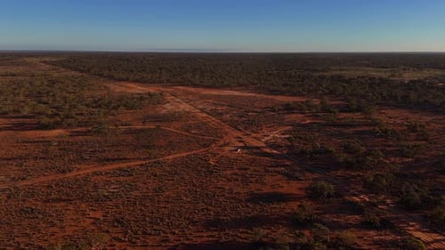 Wide Aerial of Sunlit Red Outback Plains