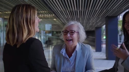 Cheerful Group of Mature Businesswomen Gathering Outside Work Office Laughing Together