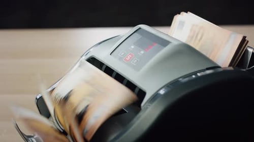 Counter Machine Calculating Euro Banknotes Denomination of Fifty Close Up. Man Hands