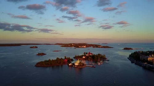 Descending aerial shot of the small islands in the Gulf of Finland off the coast of Helsinki. 4K