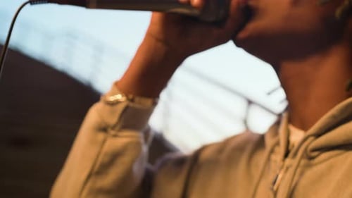 Young Black Street Musician Performing Hip-hop Song