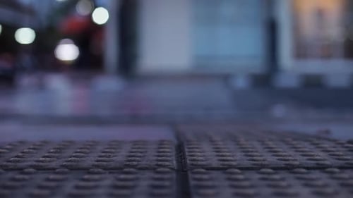 Lane for helping blind people on Pedestrian walk with blurry background of vehicles passing on the r