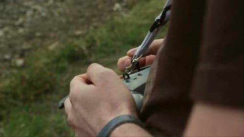 Adult Hands Operating a Drone Controller Outdoors
