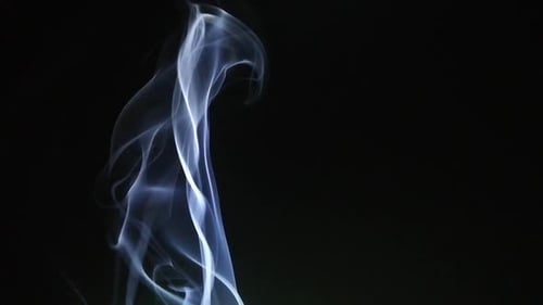 Abstract White Smoke Swirling on Black Background