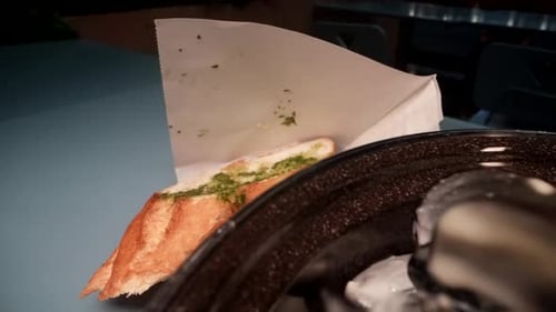 Delicious Meal in Seafood Restaurant Closeup View of Saucepan with Mussels in Sauce and Bread