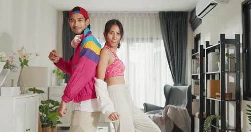 Cheerful Young Adults Dancing Together Indoors