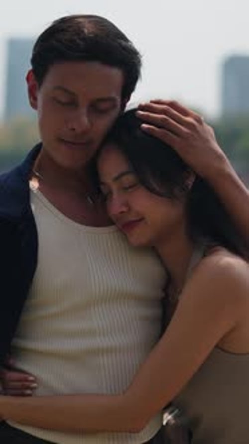 Loving Couple Embracing in Park on Sunny Day