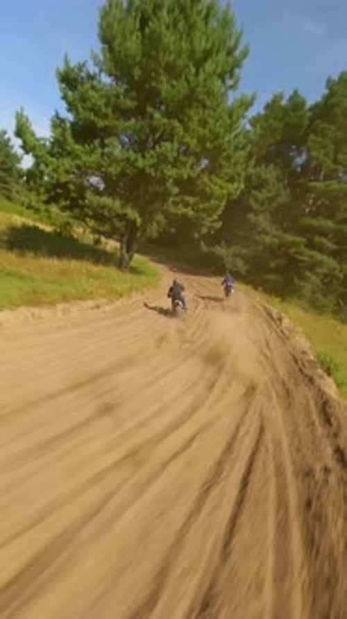 Dirt Bikes Riding Down Dirt Road