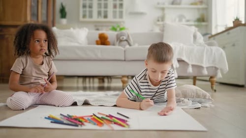 Boy and Girl Drawing Together Indoors