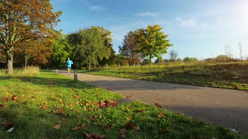 4k video footage of a man enjoying a run in the park