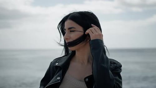 Young Woman with Flowing Hair at the Beach