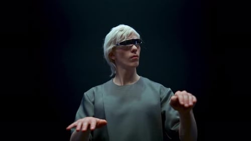 Man with Futuristic Glasses Interacts with Virtual Screen