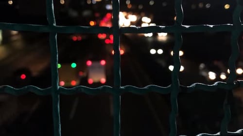Timelapse of traffic traffic can be with a road divider wire in the foreground